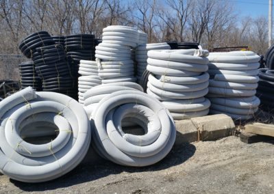 CORRUGATED PIPE ROLLS - DRAIN TILE. SOCK / SLEEVE AVAILABLE ON OR OFF